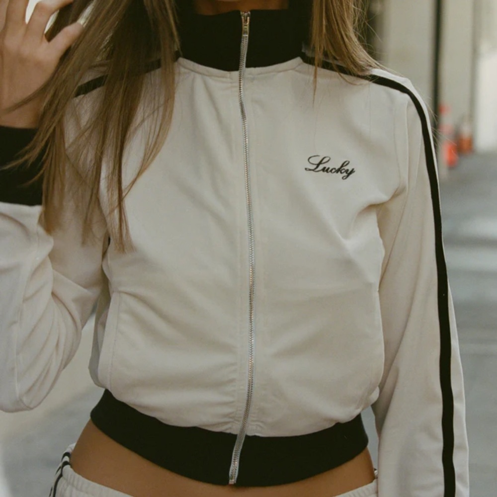 With Jean track pant and zip through.